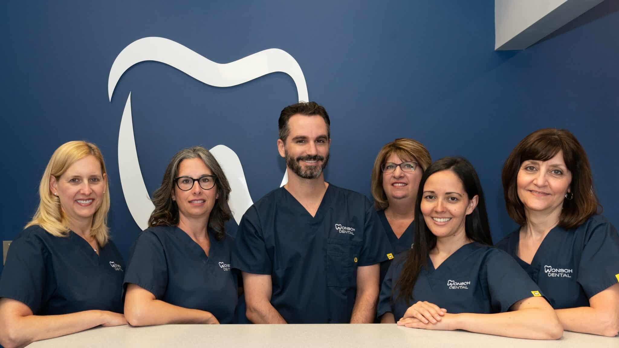 6 smiling professional Dentist Windsor Specializing In Family Dentistry